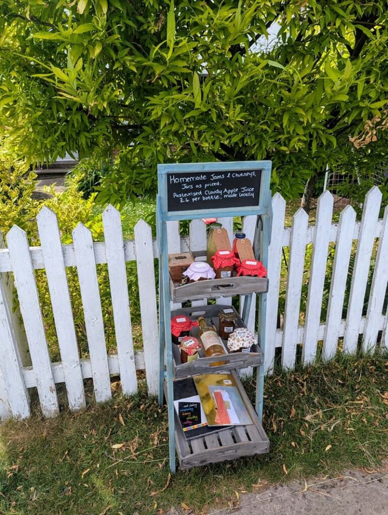 Honesty stall outside a cottage in Goathland, North Yorkshire — a charming example of slow living in the English countryside, displaying homemade jam, chutney, and local produce