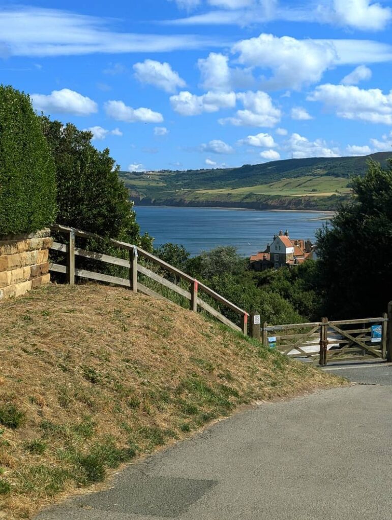 Scenic viewpoint overlooking Robin Hood’s Bay on the North Yorkshire coast, with sweeping views of cliffs, sea, and the English countryside.