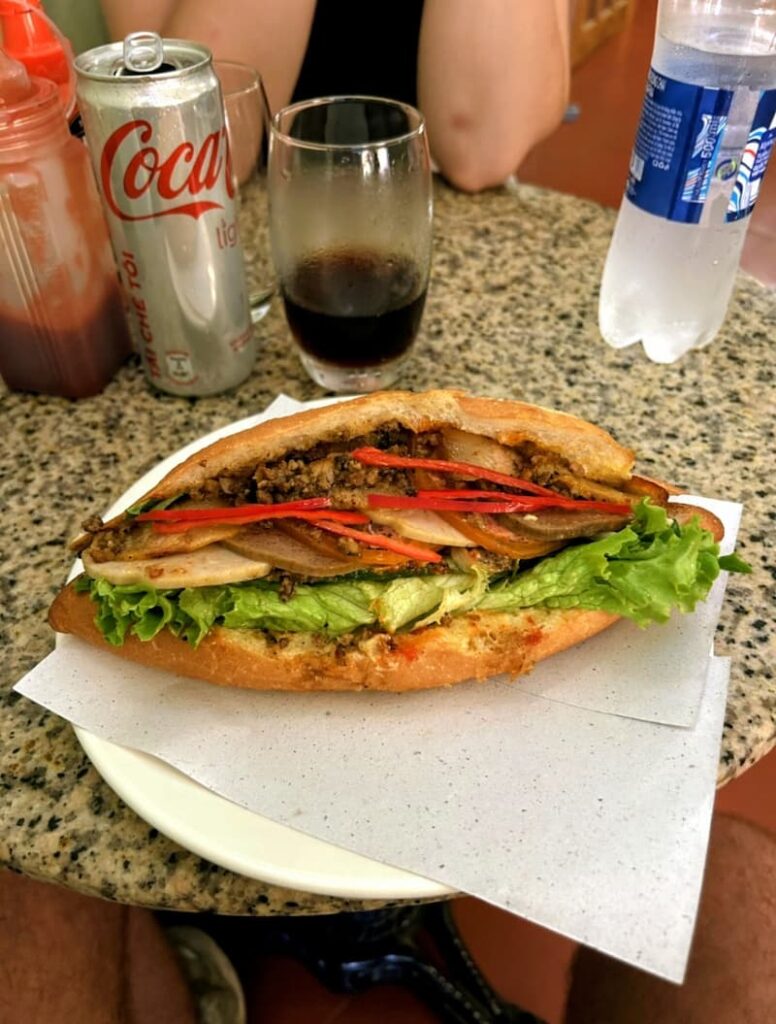 Bánh Mì Nữ DELI Baked Goods, Hoi An, Vietnam. Original Bánh Mì stuffed with ingredients.