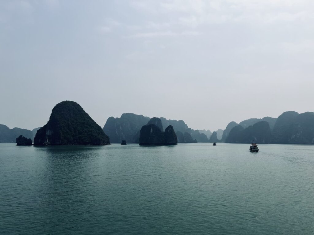 Views over Ha Long Bay in Vietnam showing the islands and boats